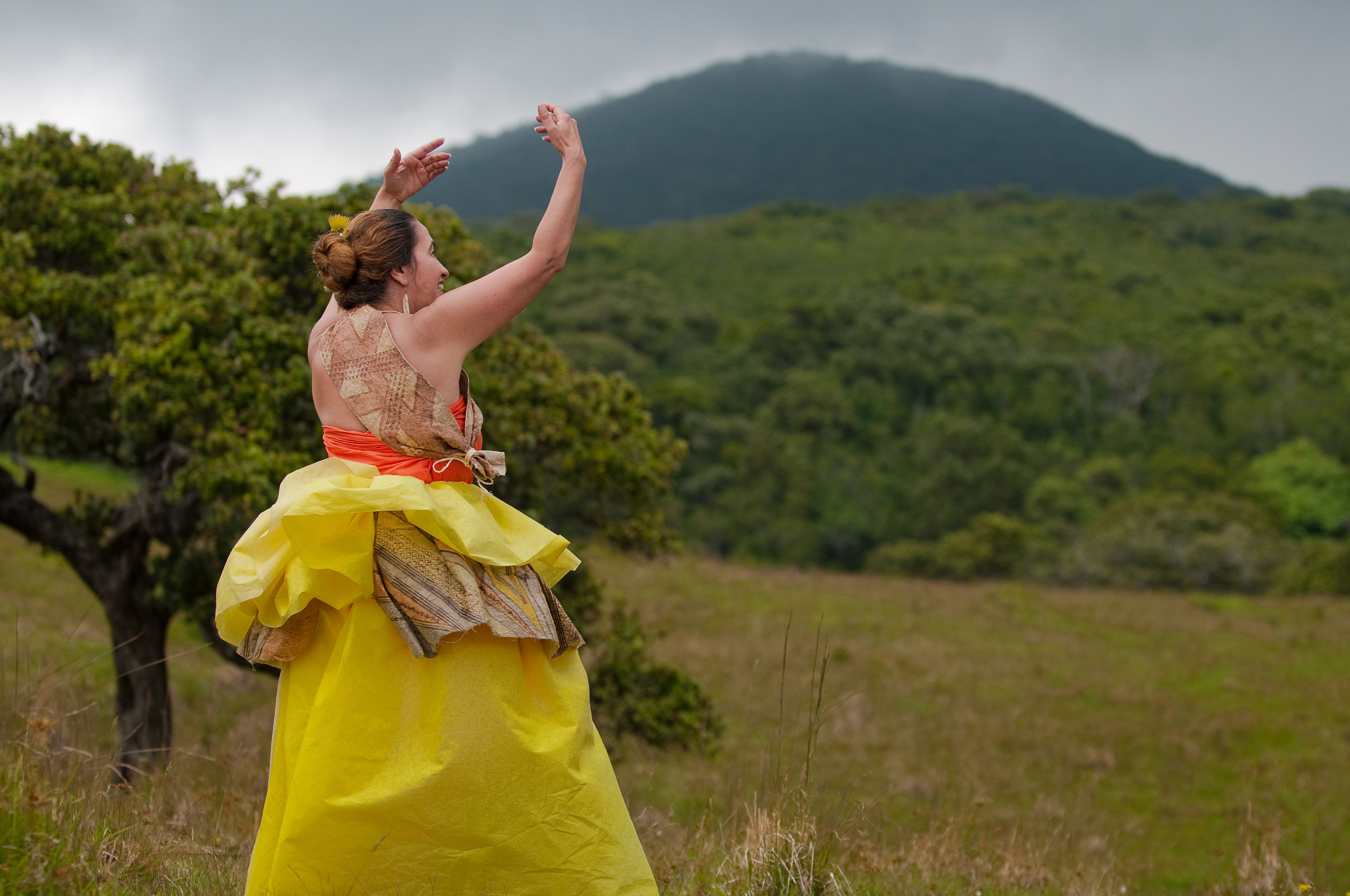 [Hula dancer chanting outside] Photo by Ruben Carillo.